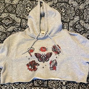 Girrlscout cropped tattooed hoodie.